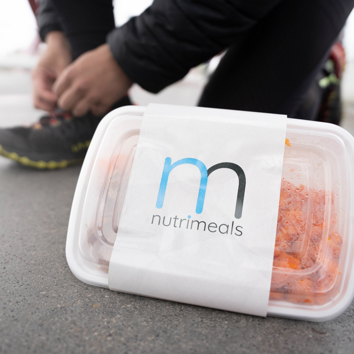 person tying shoelace 