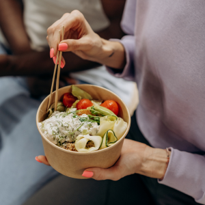 girl holding a bowl of salad