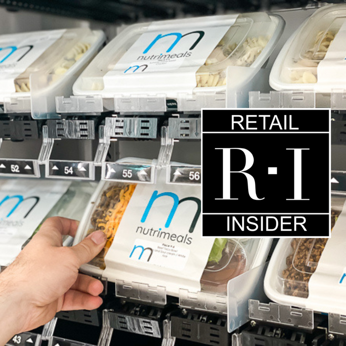 Person holding meal in vending machine