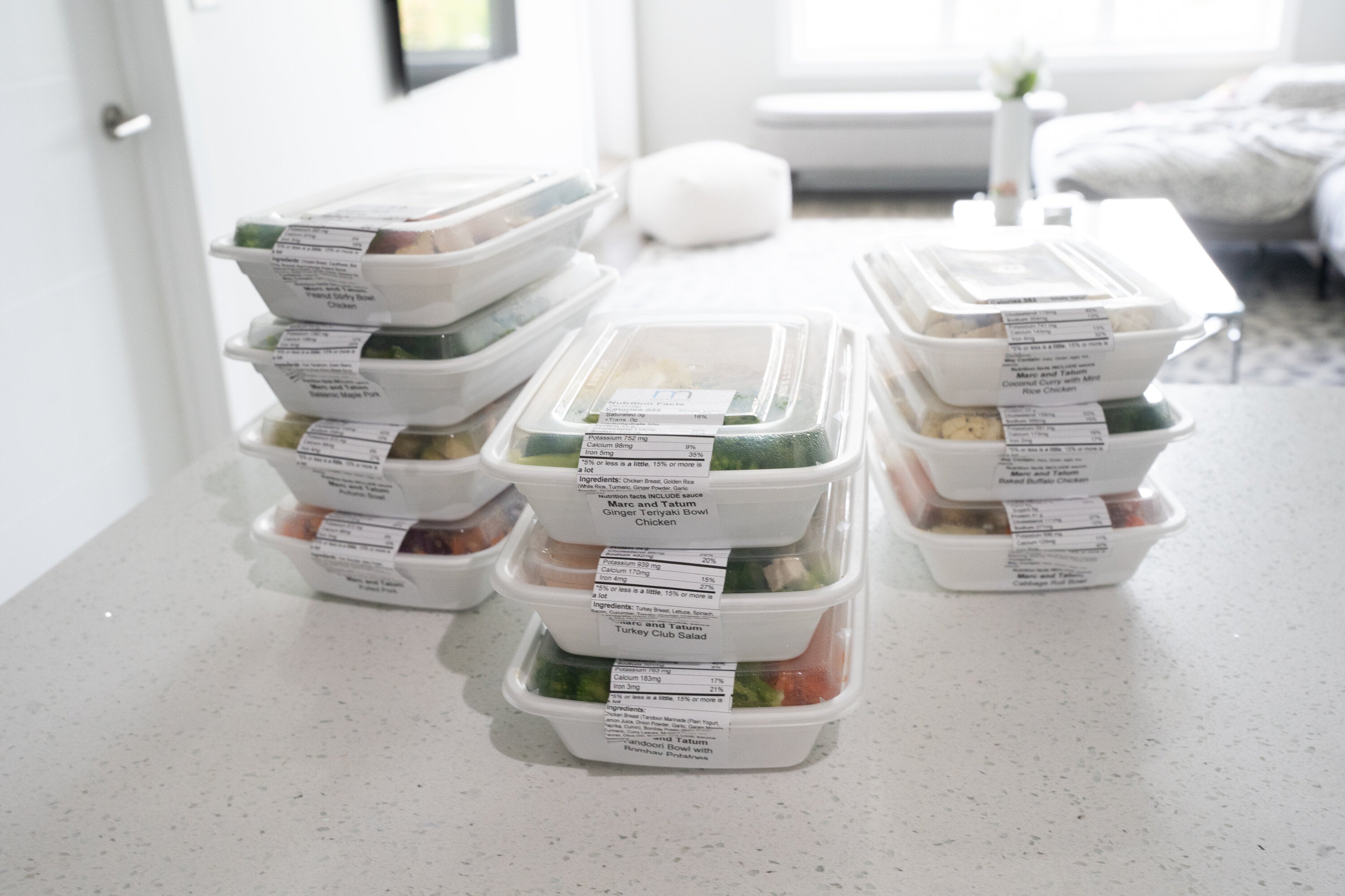 stack of healthy meal prep on white counter