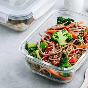 glass container of healthy noodle stirfry 